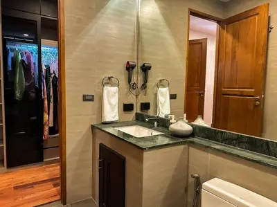 a bathroom with a sink and a mirror at 1897summer villa 曼谷中心7卧Asok&Thong Lor800平米海天别墅 in Bangkok