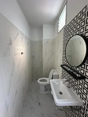 a bathroom with a toilet and a sink and a mirror at Phuket vibe, City House, 7 mins to BTS, City center, Private room in Sathon, Private bathroom, Bangkok, Thailand in Bangkok