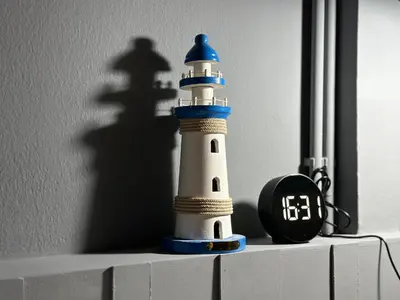 a toy lighthouse sitting on top of a shelf at Phuket vibe, City House, 7 mins to BTS, City center, Private room in Sathon, Private bathroom, Bangkok, Thailand in Bangkok
