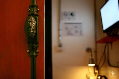 a close up of a door in a room at T-Boutique Hostel - Hua Lamphong in Bangkok