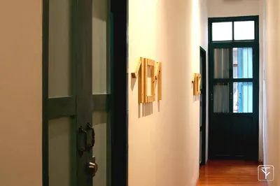 a door that is open to a hallway at T-Boutique Hostel - Hua Lamphong in Bangkok