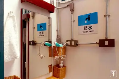 a bathroom with a mirror and a sink at T-Boutique Hostel - Hua Lamphong in Bangkok