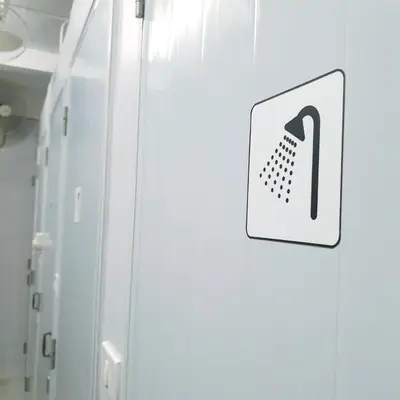 a white cabinet with a sign on it at Cooper in Bangkok