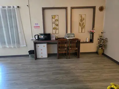 a room with a desk and two chairs in a room at Victory place 2 (Golden Mount) in Bangkok