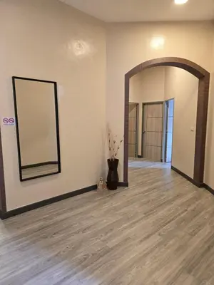an empty room with a large mirror on the wall at Victory place 2 (Golden Mount) in Bangkok