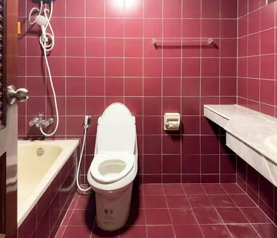 a bathroom with a toilet and a tub and a sink at Private House 3 Suite Beds + Double Beds in Heart of Phromphong in Bangkok