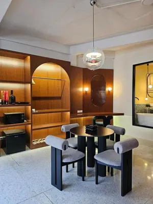 a dining room with a table and chairs at Yaowarat Stay in Bangkok