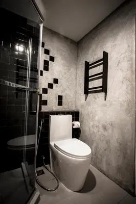a bathroom with a toilet and a shower at C U Inn Bangkok in Bangkok