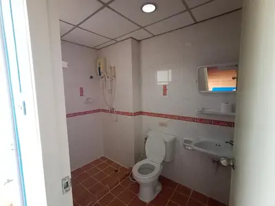 a bathroom with a toilet and a sink at jw place รามคำแหง 40 in Bangkok