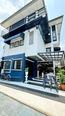 two bikes parked in front of a building at FRIENDS@SaiLom in Bangkok