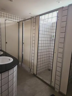 a bathroom with a sink and a mirror at Line Bangkok Hostel in Bangkok
