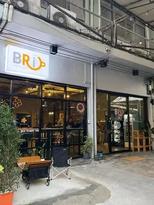 a store front of a building with a sign on it at Brio Cafe and Hostel in Godown