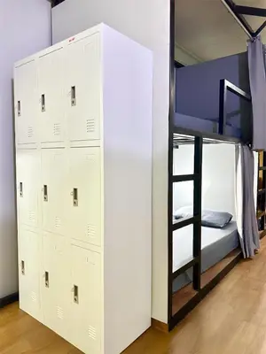 a bedroom with two bunk beds and a bunk bed at Bed Space Hostel Khaosan in Bangkok