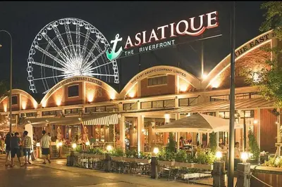 a large building with a ferris wheel in the background at Iconic skyline, Big apartment, Great location in Bangkok