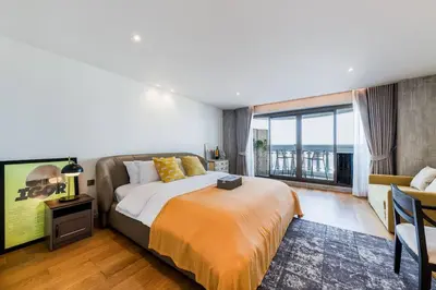 a bedroom with a bed and a large window at Iconic skyline, Big apartment, Great location in Bangkok