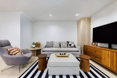 a living room with a couch and a tv at Iconic skyline, Big apartment, Great location in Bangkok