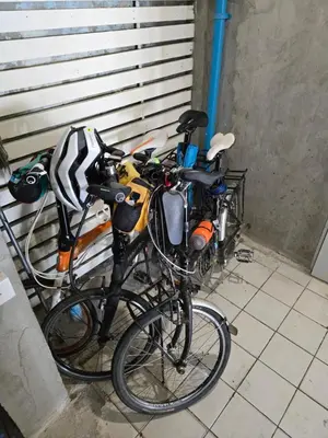 two bikes are parked next to each other at House Ju in Bangkok