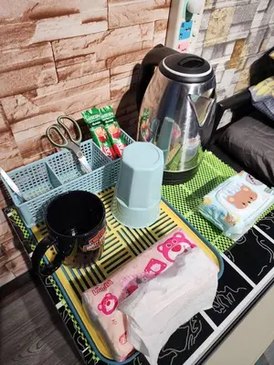 a table with a tea pot and a tray with food at 211 Spacious studio with breezy fan full amenities with free Wi-Fi in Bangkok