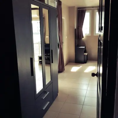 a door to a room with a tile floor at The State Apartment in Bangkok