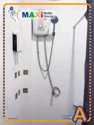 a stethoscope hanging on a wall in a bathroom at MAXi MaMa House in Bangkok