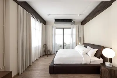 a bedroom with a bed and a large window at The Lair Bangkok - 3mins walk to ICON SIAM in Bangkok