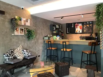 a bar in a restaurant with stools and a counter at BaanTip​ HomStay in Bangkok