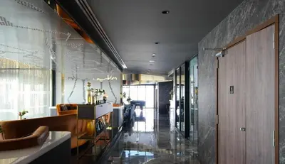 a room with a hallway with a lobby with a unintention at Modern condo nr BTS ONNUT WIFI in Bangkok