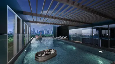 a swimming pool with a view of a city at ARNI Skye Hotel in Bangkok