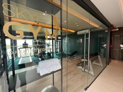a store window with a sign that reads shopify at ARNI Skye Hotel in Bangkok