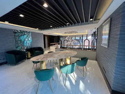 a meeting room with a table and chairs at ARNI Skye Hotel in Bangkok