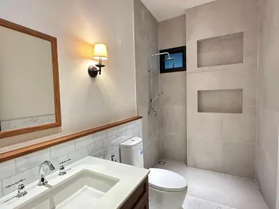 a bathroom with a sink and a toilet and a mirror at House40 MRT Ratchadaphisek in Bangkok
