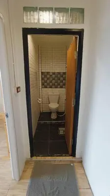 a small bathroom with a toilet in a room at Chubby 9 Standard room in Ban Bang Phlat