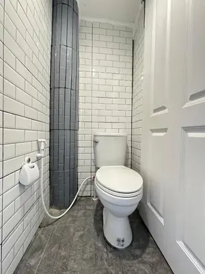 a bathroom with a white toilet in a room at Chubby 9 Standard room in Ban Bang Phlat
