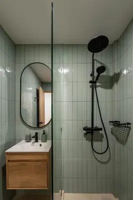 a bathroom with a shower with a sink and a mirror at 2 Bed 2 Bath / Luxury / 1 min walk to BTS Asok in Bangkok