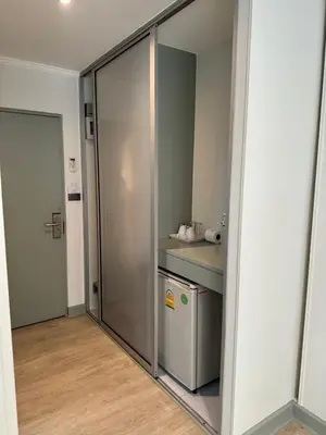 a sliding glass door in a kitchen with a counter at O'Shea's Sukhumvit Bangkok in Khlong Toei