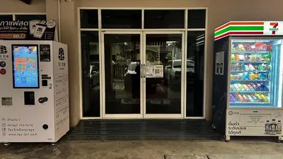 a store front with a door and a refrigerator at One Deves in Bangkok