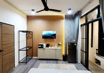 a kitchen with a ceiling fan and a refrigerator at Lasalle House - 4- storey entire house with rooftop 200 sqm Suvarnabhumi airport ,BTS in Bangkok