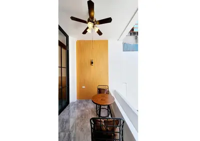 a dining room with a ceiling fan and a table at Lasalle House - 4- storey entire house with rooftop 200 sqm Suvarnabhumi airport ,BTS in Bangkok