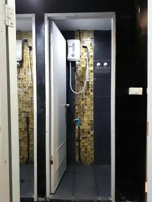 a room with a bathroom with a shower in it at 24 hr Hostel in khaosan road in Bangkok