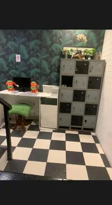an office with a desk and a checkered floor at 24 hr Hostel in khaosan road in Bangkok