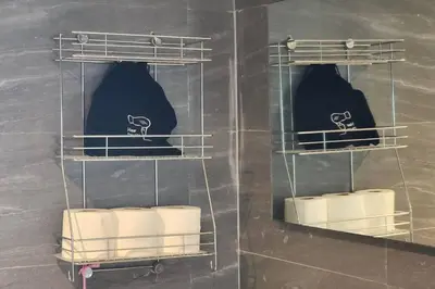 a bathroom with three shelves with towels and towels at SelfCheckIn The State Tower RiverView 2Bedroom BTS ICONSIAM Silom Sathon in Bangkok