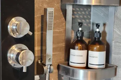 two bottles of wine are in a machine at SelfCheckIn The State Tower RiverView 2Bedroom BTS ICONSIAM Silom Sathon in Bangkok