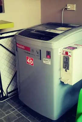 a machine sitting on the floor in a kitchen at Mimi Cozy Apartment- Old town Siriraj Wanglang Market in Bangkok