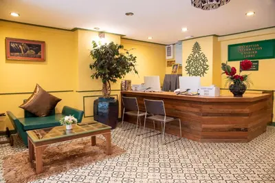 a waiting room with a cash register and a table at 75 Paradise Lane Managed by Loft Group in Bangkok