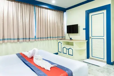 a bedroom with a bed with towels on it at 75 Paradise Lane Managed by Loft Group in Bangkok