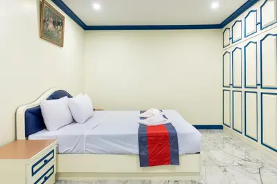 a bedroom with a bed and a desk in a room at 75 Paradise Lane Managed by Loft Group in Bangkok