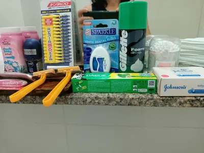 a counter with toothbrushes toothpaste and other bathroom items at Condo I-House Laguna Garden RCA - Behind Sukhumvit Thonglor Asoke Emporium Bangkok Hospital Piyavet Hospital Makkasan Airport Link MRT SKY TRAIN in Bangkok