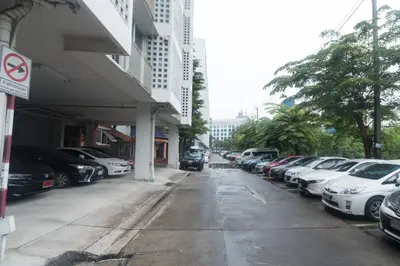 a row of cars parked in a parking lot at Condo I-House Laguna Garden RCA - Behind Sukhumvit Thonglor Asoke Emporium Bangkok Hospital Piyavet Hospital Makkasan Airport Link MRT SKY TRAIN in Bangkok