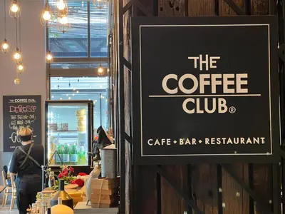 a sign on the wall of a coffee shop at Holiday Inn Express Bangkok Sukhumvit 11 by IHG in Bangkok