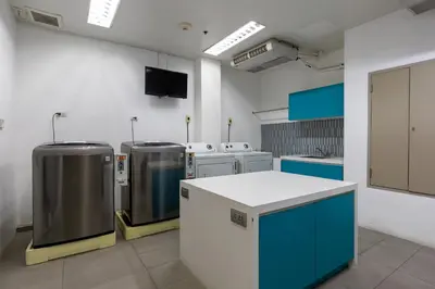 a kitchen with several machines in a room at Holiday Inn Express Bangkok Sukhumvit 11 by IHG in Bangkok